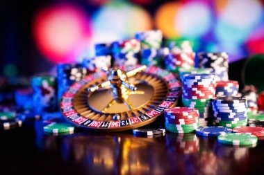 Live Casino Hold'em dealer at table with community cards visible